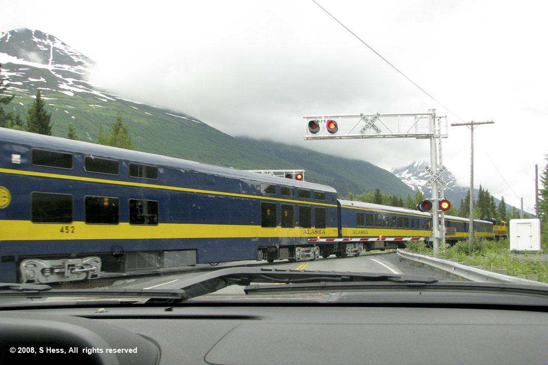 Alaska Railroad train crossing the Seward Highway